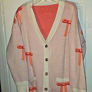 Oversized cardigan with bow print